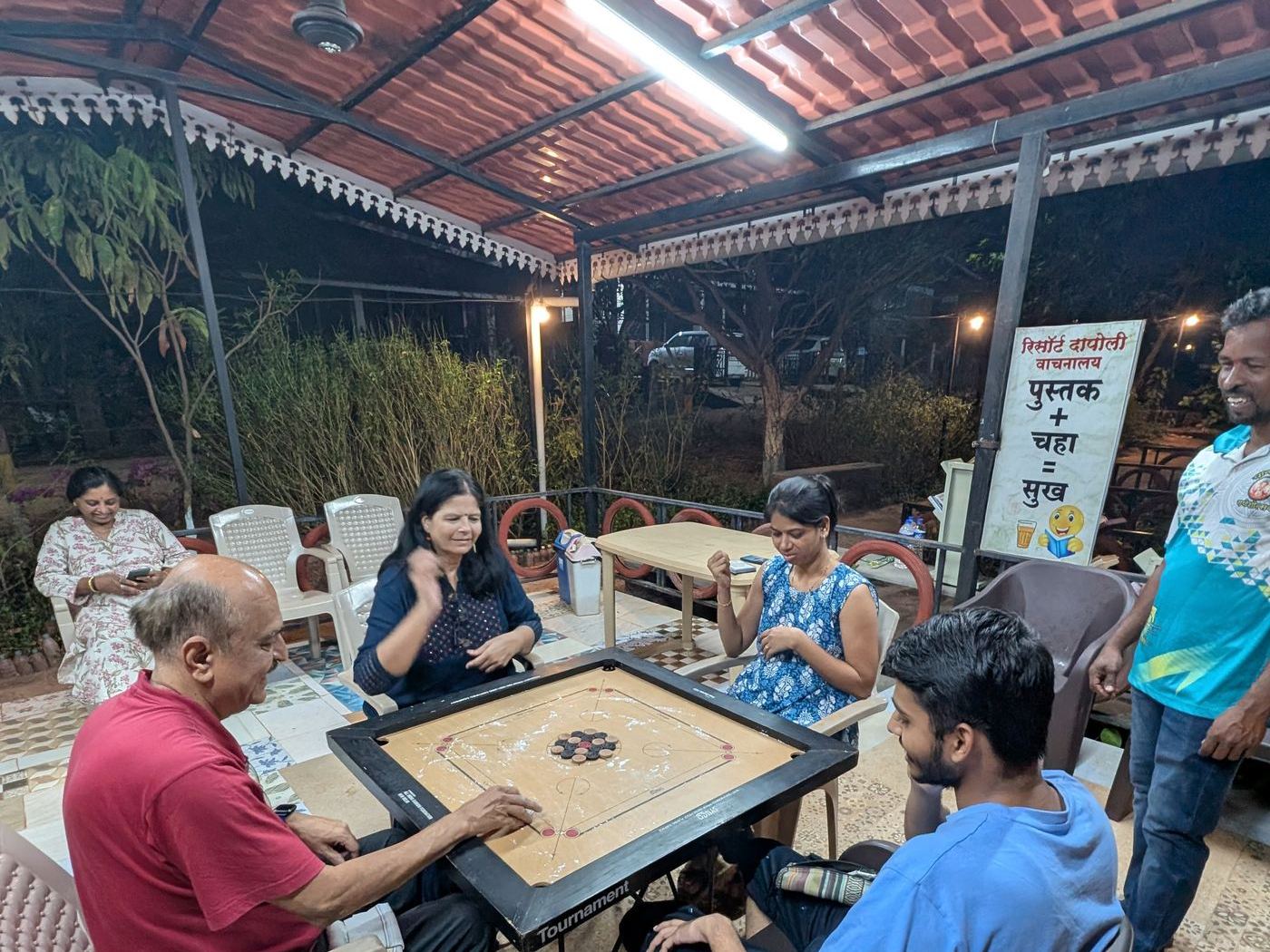 Residents at the library and tea corner at Resort Dapoli